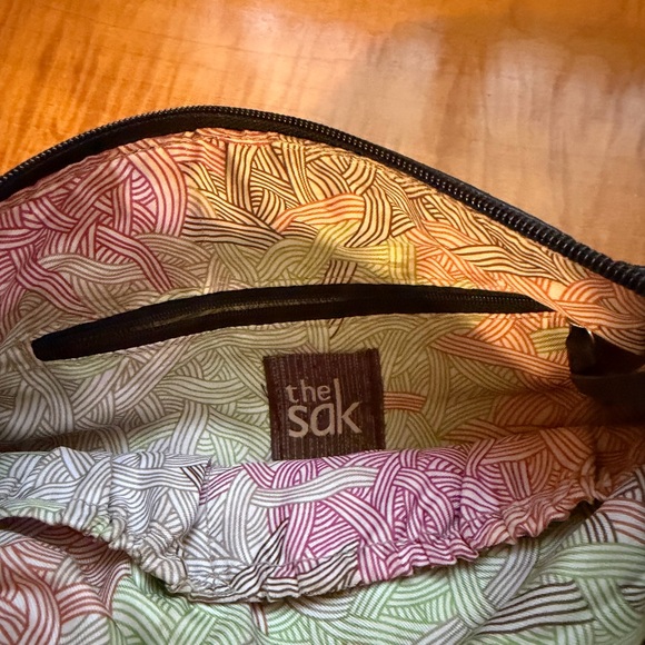 The Sak Laurel Crossbody Bag in a black, tan, and cream color-block design. - Picture 4 of 4